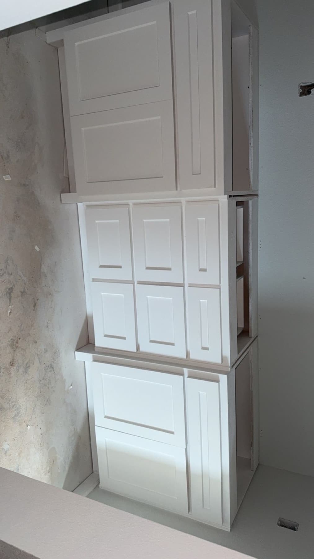 White cabinet doors after detailed paint finish